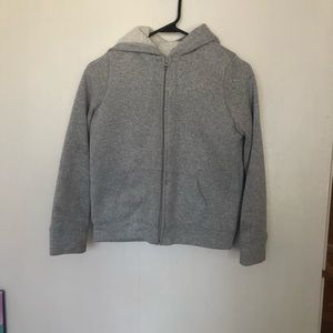 Children place sweater
